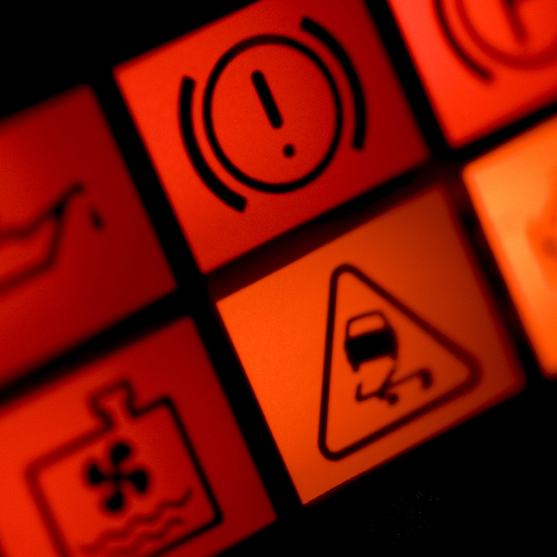 Car dashboard warning lights highlighting the requirement for diagnostic attention